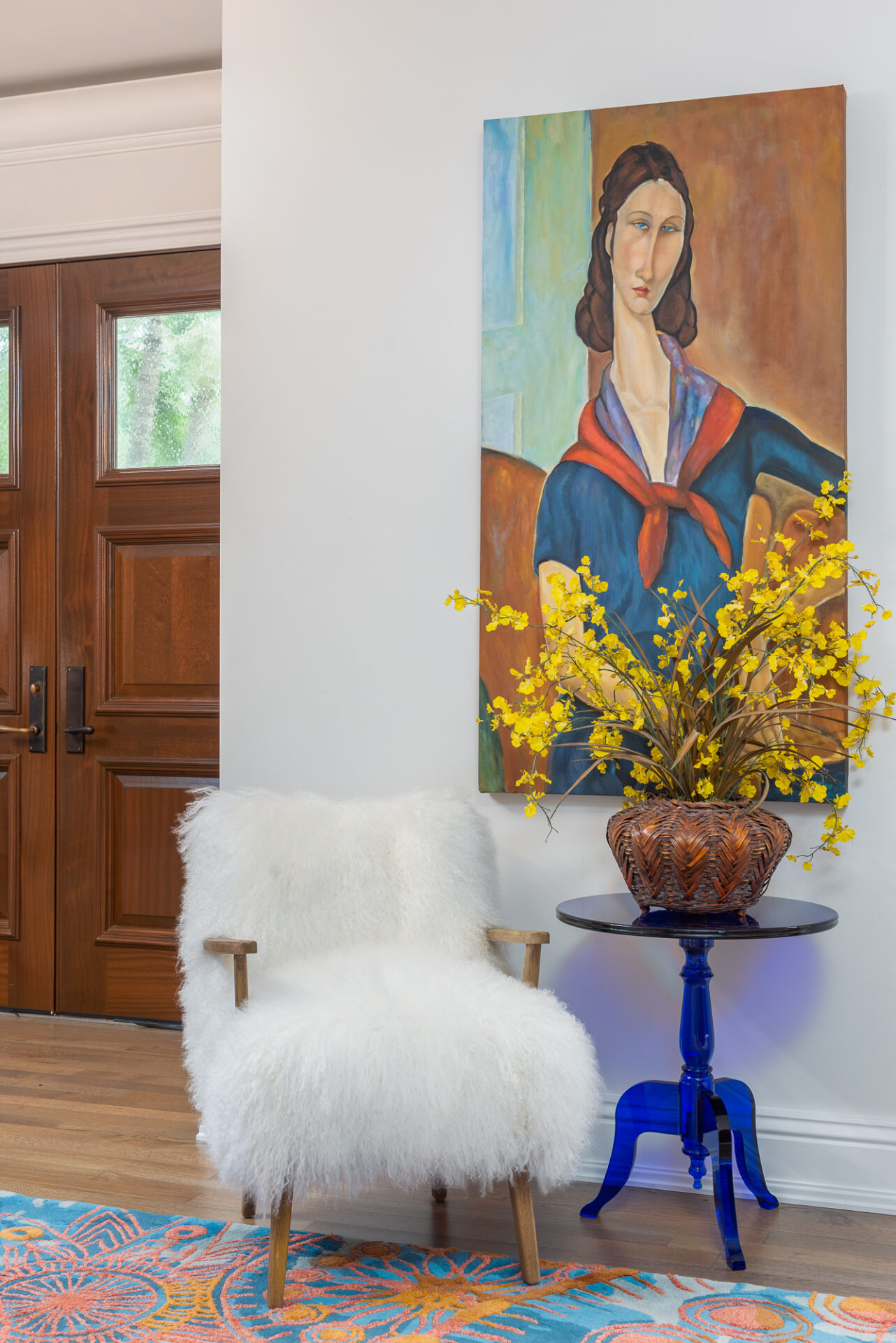 A painting and fluffy seat on the lounge