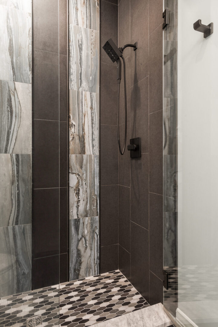 A Brown and White Color Bathroom Tiled Wall and Floor