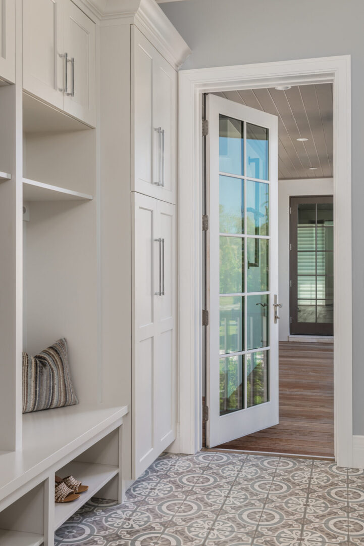 A White Glass Paneled Door to a Carpet Space