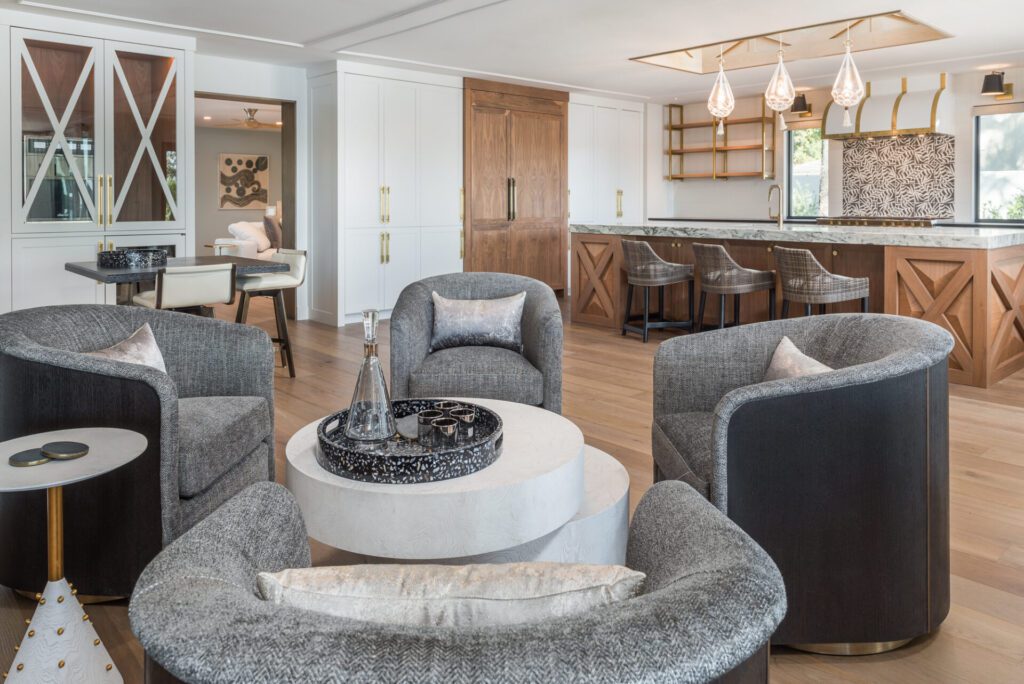 A living room with gray furniture and white walls.