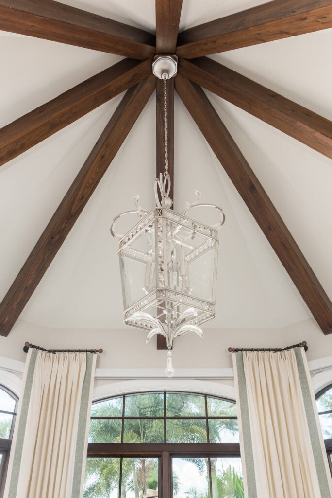 A chandelier hanging from the ceiling in a room.