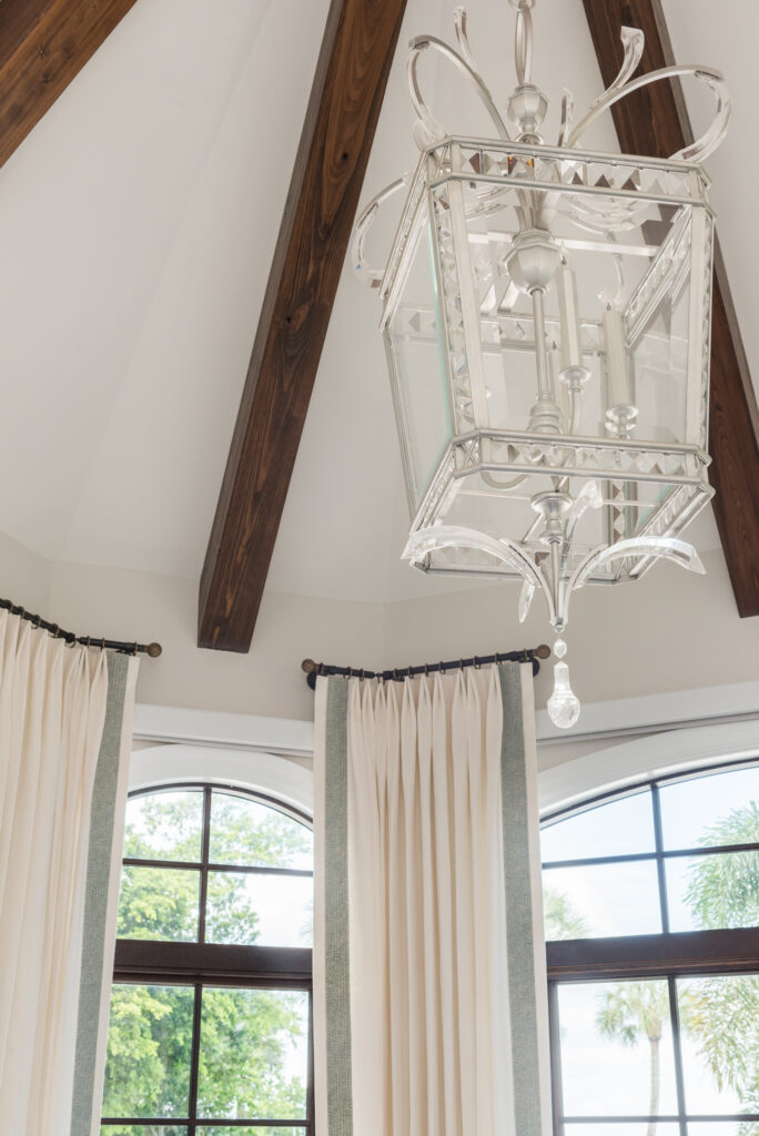 A chandelier hanging from the ceiling in a room.