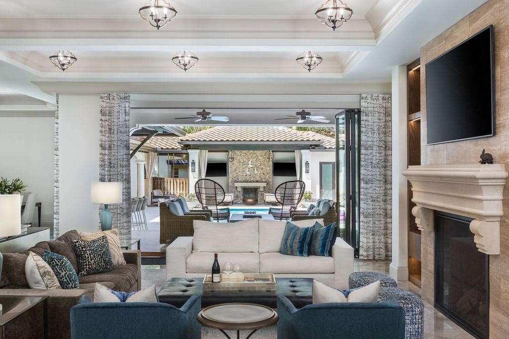 Spacious living room opening to pool patio